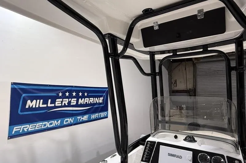 Slide: The Image of 2026 Robalo 226 Cayman boat interior with Simrad display at Miller's Marine. - 9