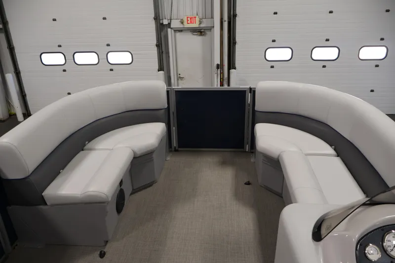 Slide: The Image of 2020 Bentley Pontoons 180 CRUISE interior with plush seating in a garage setting. - 10