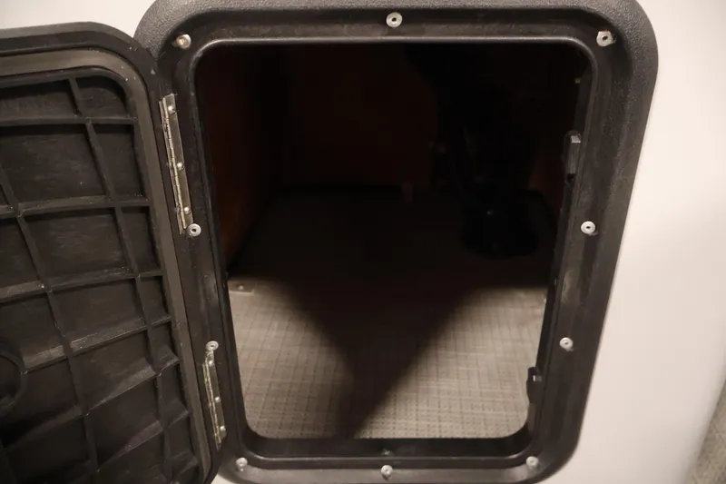 Slide: The Image of Open storage compartment on a 2020 Bentley Pontoons 180 CRUISE boat. - 16