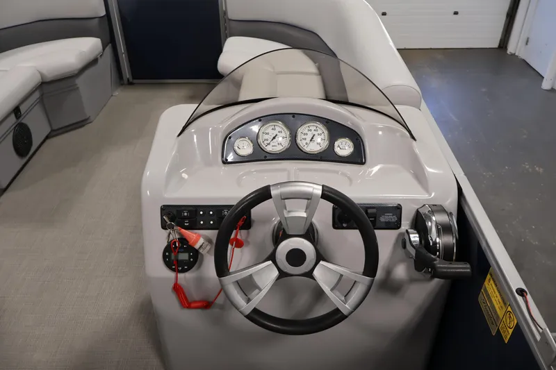 Slide: The Image of 2020 Bentley Pontoons 180 CRUISE dashboard with steering wheel and gauges. - 17