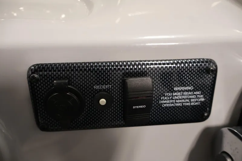 Slide: The Image of Control panel of 2020 Bentley Pontoons 180 CRUISE with stereo and warning label. - 22