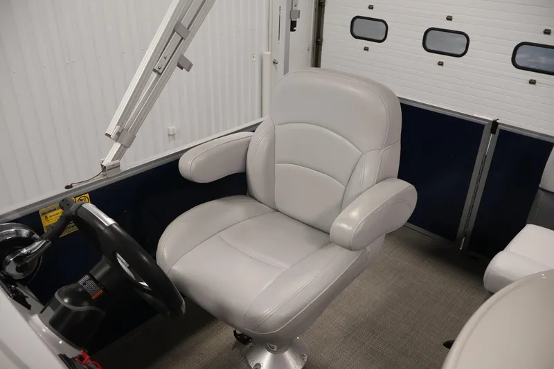 Slide: The Image of 2020 Bentley Pontoons 180 CRUISE captain's chair in a sleek, modern interior. - 24
