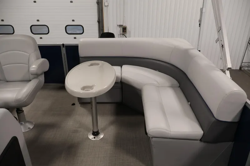 Slide: The Image of 2020 Bentley Pontoons 180 CRUISE interior with gray seating and oval table. - 25