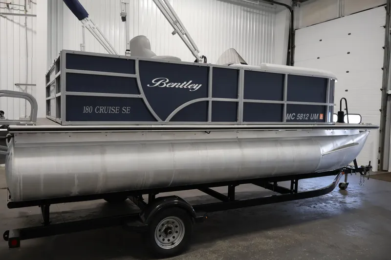 Slide: The Image of 2020 Bentley Pontoons 180 CRUISE on trailer in indoor storage facility. - 3