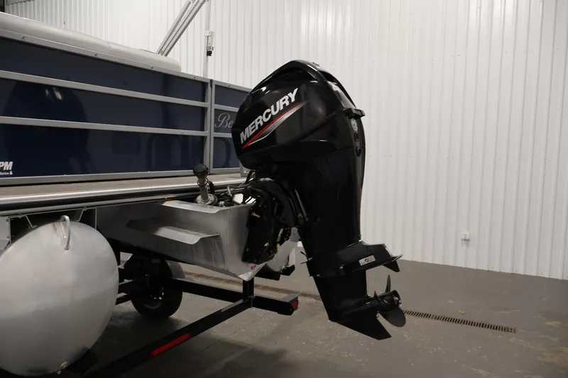 Slide: The Image of 2020 Bentley Pontoons 180 CRUISE with Mercury outboard motor in a garage setting. - 31