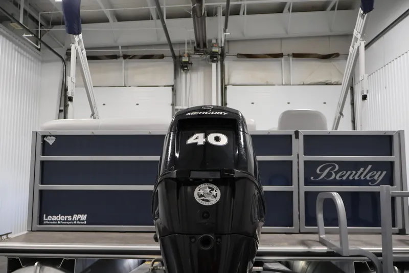 Slide: The Image of 2020 Bentley Pontoons 180 CRUISE with Mercury 40 engine in a garage setting. - 32
