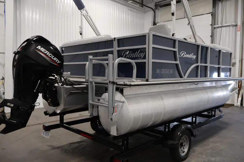 Slide: The Image of 2020 Bentley Pontoons 180 CRUISE with Mercury engine in a garage setting. - 4