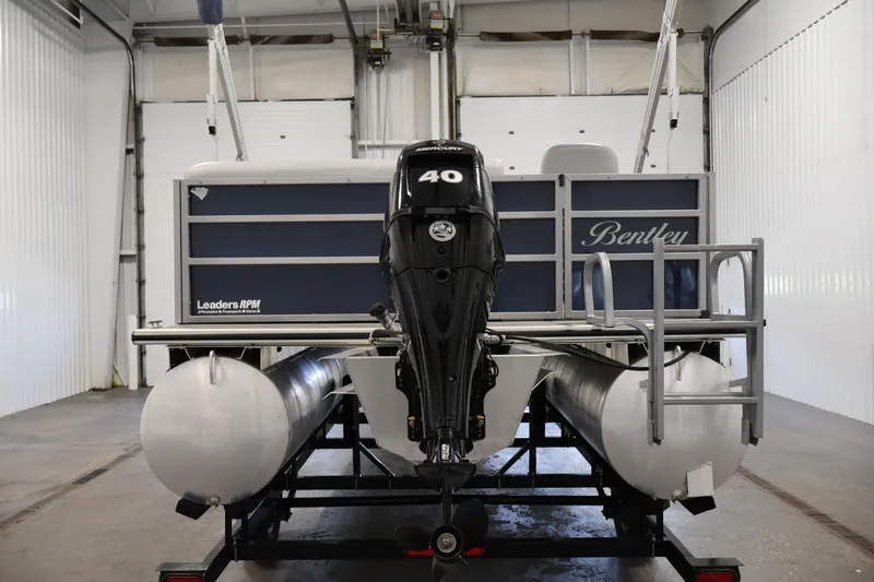Slide: The Image of 2020 Bentley Pontoons 180 CRUISE with 40 HP engine in a garage setting. - 5