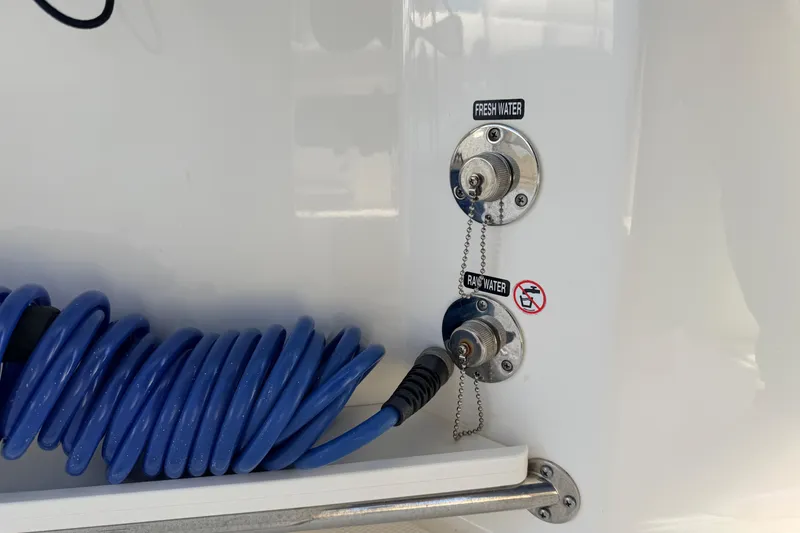Slide: The Image of Fresh and raw water outlets on a 2022 Boston Whaler 250 Outrage boat. - 22