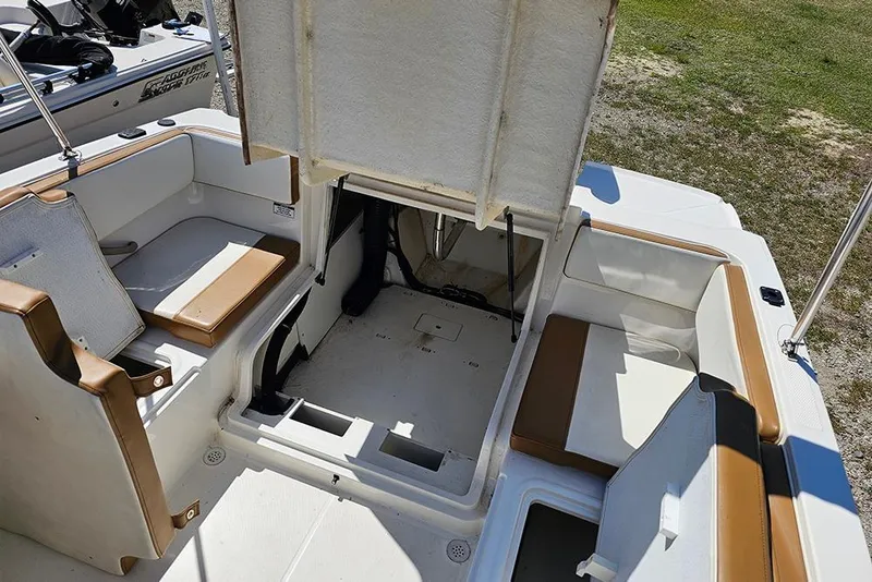 Slide: The Image of 2021 Bayliner VR4 Bowrider OB interior with open storage compartment and seating. - 10