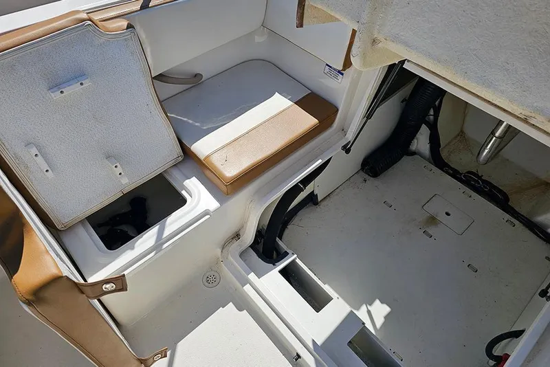 Slide: The Image of 2021 Bayliner VR4 Bowrider OB interior storage compartments and seating area. - 11