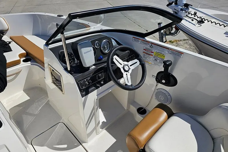 Slide: The Image of 2021 Bayliner VR4 Bowrider OB cockpit with steering wheel and Garmin navigation system. - 14