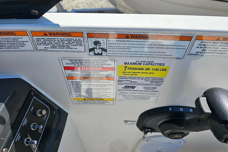 Slide: The Image of 2021 Bayliner VR4 Bowrider OB dashboard with safety warnings and capacity details. - 16