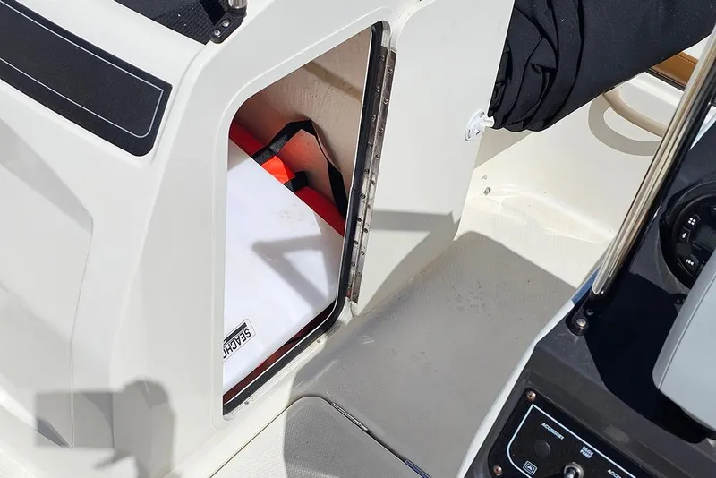 Slide: The Image of 2021 Bayliner VR4 Bowrider OB storage compartment with life jacket inside. - 18