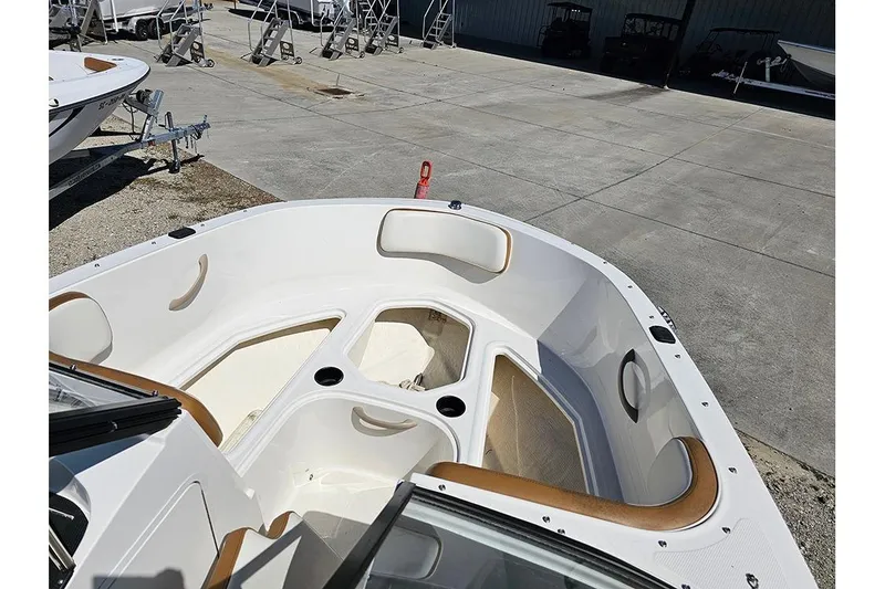 Slide: The Image of 2021 Bayliner VR4 Bowrider OB boat interior with seating and storage compartments. - 20