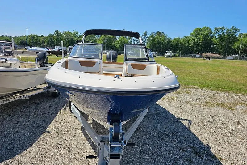 Slide: The Image of 2021 Bayliner VR4 Bowrider OB on trailer, parked outdoors on a sunny day. - 4