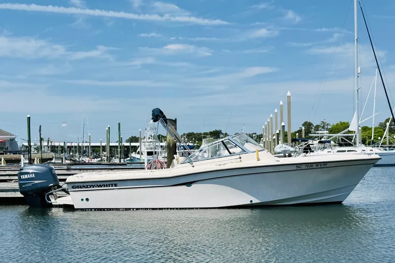 The Image of 2005 Grady-White Tournament 225 boat docked in marina with Yamaha outboard motor. - 1