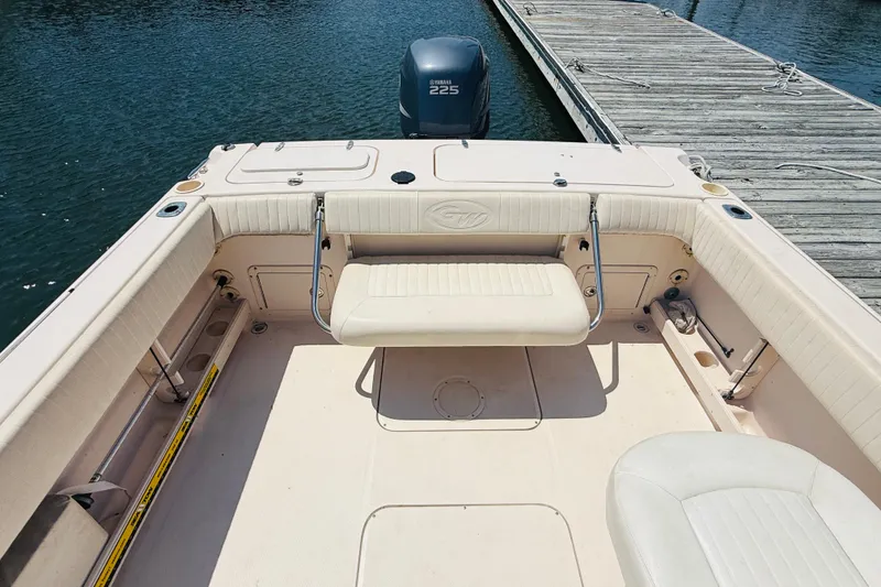 Slide: The Image of 2005 Grady-White Tournament 225 boat interior with seating and Yamaha 225 engine. - 4