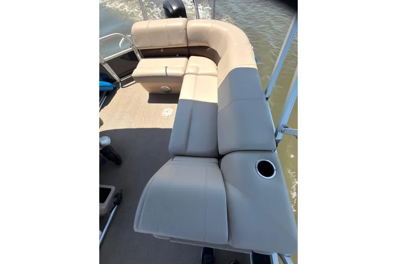 Slide: The Image of 2019 SUNTRACKER Party Barge 20 DLX with beige seating on a pontoon boat. - 10