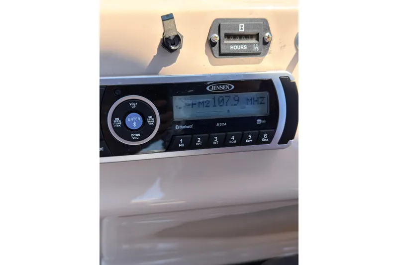Slide: The Image of Jensen radio display on 2019 SUNTRACKER Party Barge 20 DLX, tuned to FM 107.9 MHz. - 16