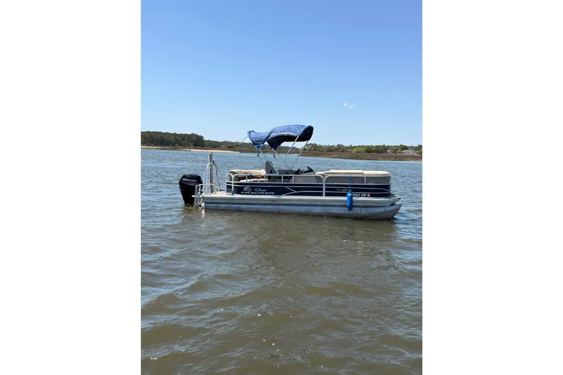 Slide: The Image of 2019 SUNTRACKER Party Barge 20 DLX pontoon boat on a calm lake. - 3