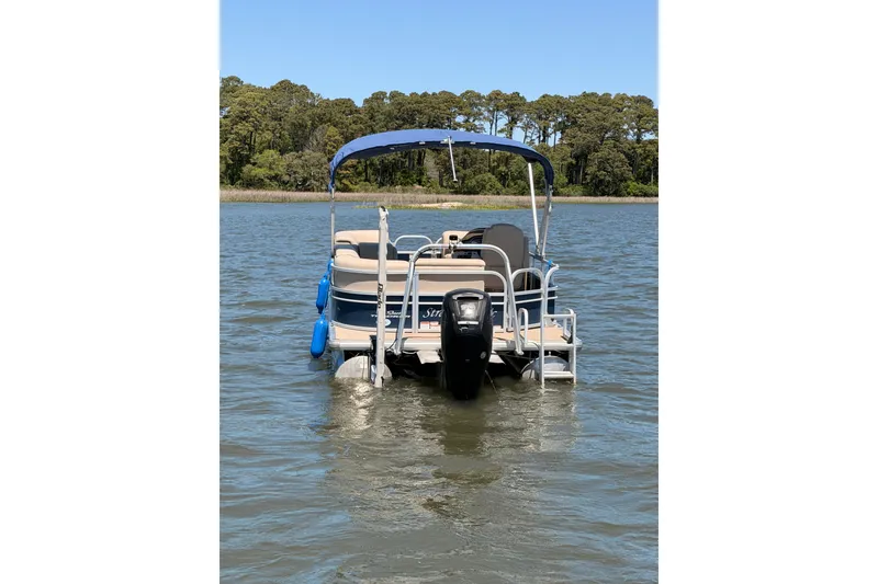Slide: The Image of 2019 SUNTRACKER Party Barge 20 DLX pontoon boat on a calm lake. - 6
