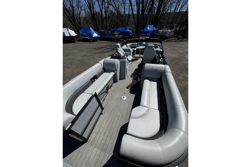 Slide: The Image of 2021 Bentley Pontoons Legacy 243 DL Navigator with spacious seating and sleek design. - 5