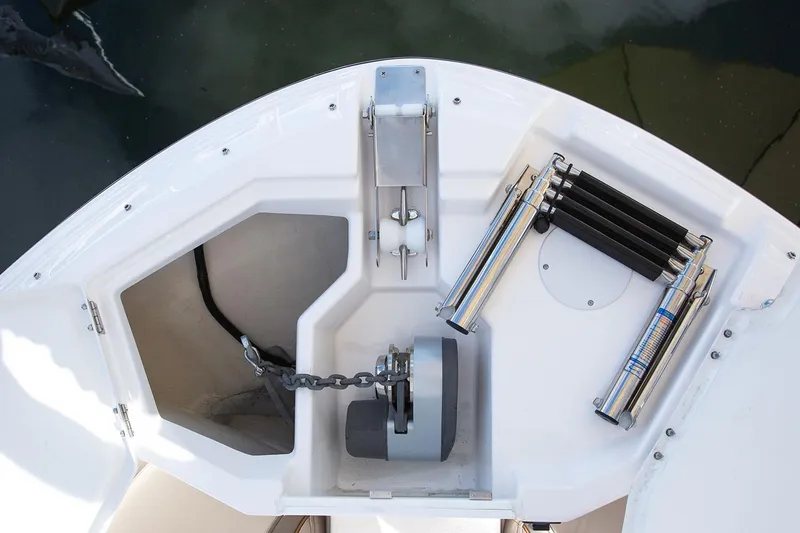 Slide: The Image of Manufacturer Provided Image: Anchor compartment of 2025 Solara S-250 CW boat with chain and accessories. - 11