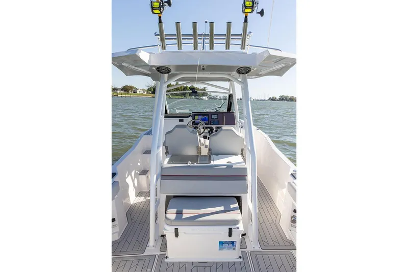 Slide: The Image of Manufacturer Provided Image: 2025 Solara S-250 CW boat interior with steering console on a lake. - 17