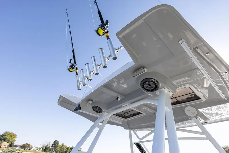 Slide: The Image of Manufacturer Provided Image: 2025 Solara S-250 CW boat with fishing rods and rod holders under clear sky. - 18