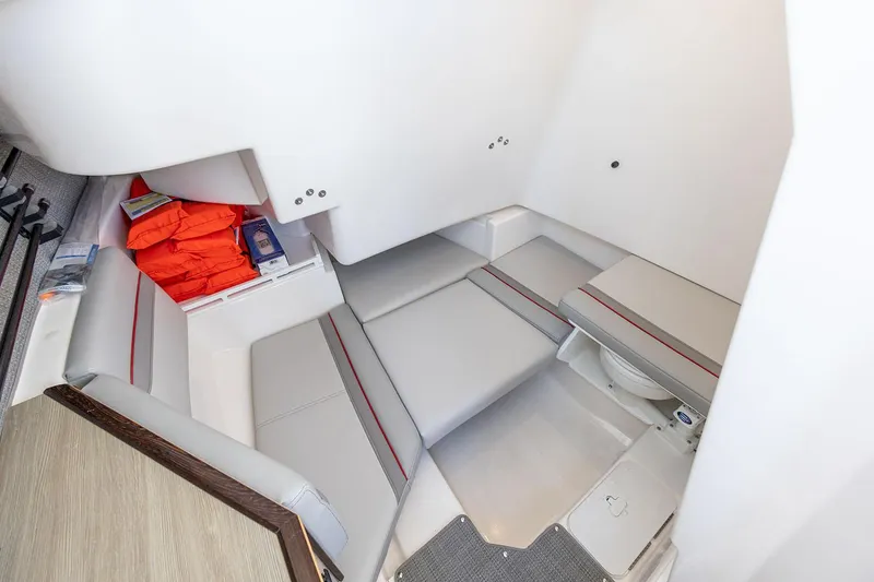 Slide: The Image of Manufacturer Provided Image: Interior cabin of 2025 Solara S-250 CW boat with seating and life jackets. - 25