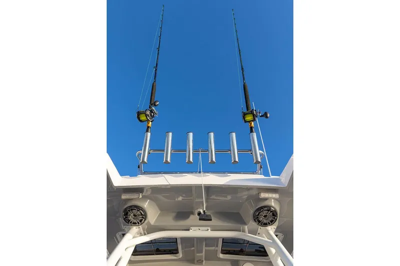 Slide: The Image of Manufacturer Provided Image: Fishing rods on Solara S-250 CW boat against clear blue sky, 2025 model. - 9