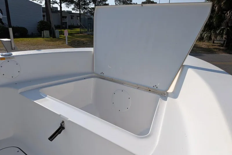 Slide: The Image of Open storage compartment on 2016 Sportsman Island Reef 17 Center Console boat. - 10