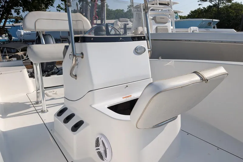 Slide: The Image of 2016 Sportsman Island Reef 17 Center Console boat interior with seating and storage. - 11