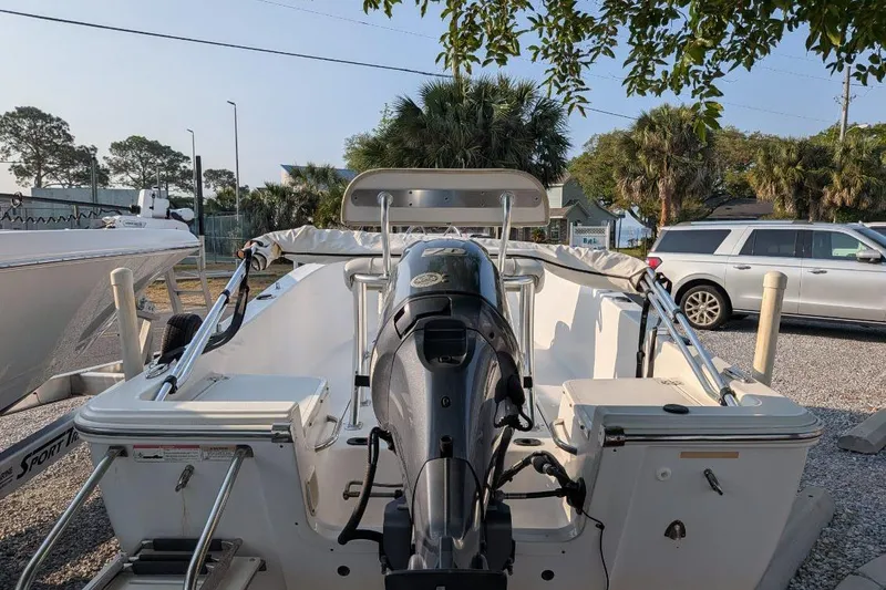 Slide: The Image of 2016 Sportsman Island Reef 17 Center Console boat with outboard motor, parked outdoors. - 12