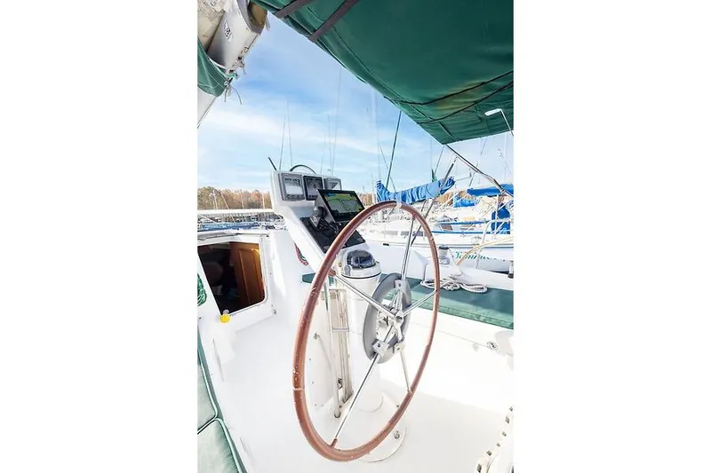 Slide: The Image of Helm of 2008 Beneteau Oceanis Clipper 343 with wooden steering wheel. - 21