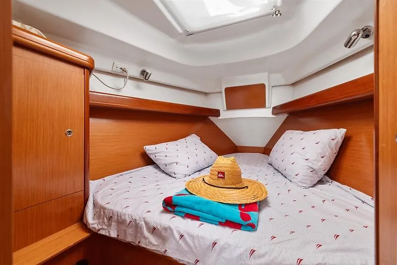 Slide: The Image of Interior of Beneteau Oceanis Clipper 343 yacht, cozy cabin with bed. - 34