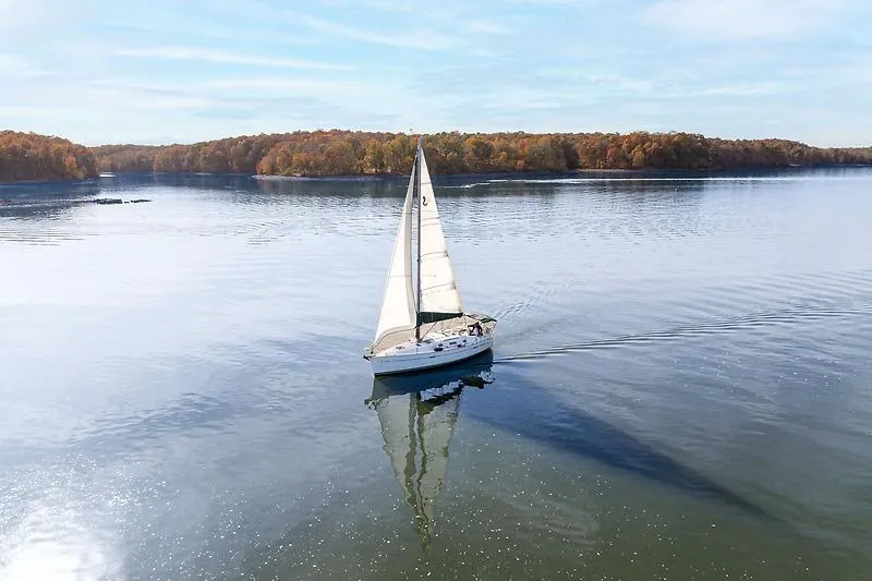 Slide: The Image of Beneteau Oceanis Clipper 343 sailing on calm lake, autumn landscape in background. - 7