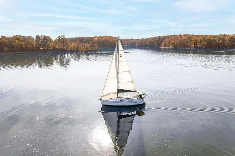 Slide: The Image of Beneteau Oceanis Clipper 343 sailing on calm lake, autumn scenery. - 8