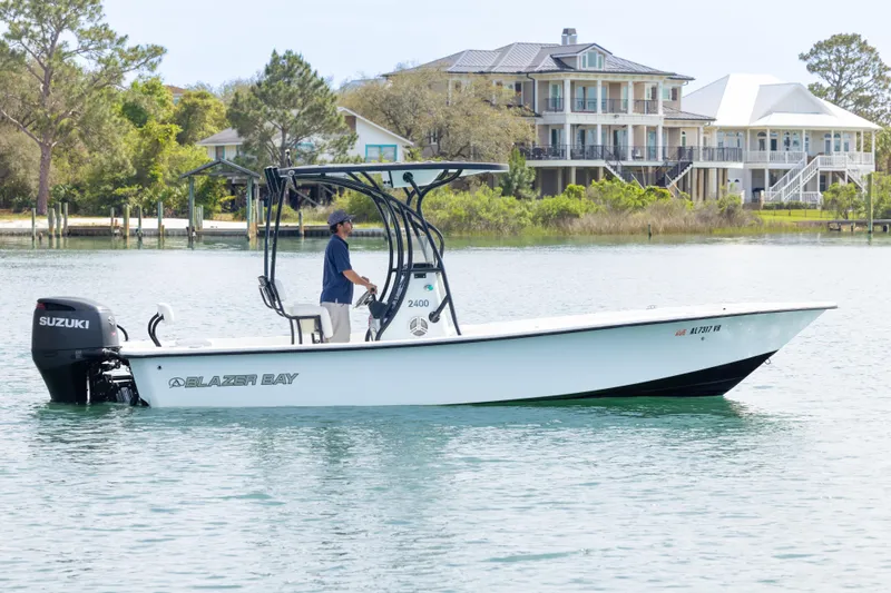 The Image of 2019 Blazer Bay 2400 boat on water with scenic waterfront homes in background. - 0