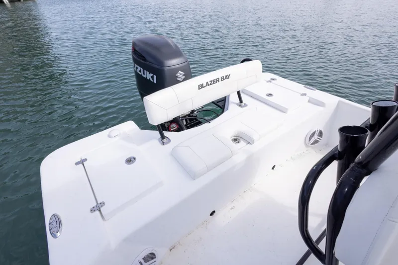 Slide: The Image of 2019 Blazer Bay 2400 boat with Suzuki outboard motor on calm water. - 13