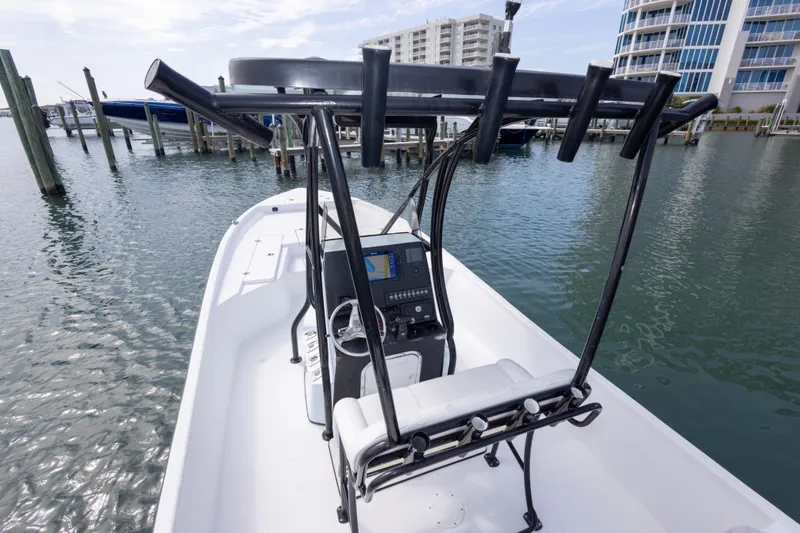 Slide: The Image of 2019 Blazer Bay 2400 boat docked near waterfront buildings. - 18