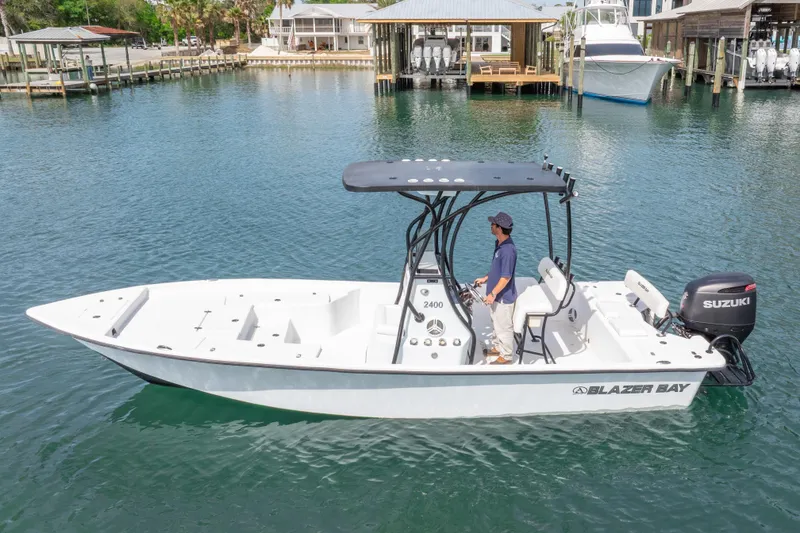 Slide: The Image of 2019 Blazer Bay 2400 boat with Suzuki engine on calm water. - 28