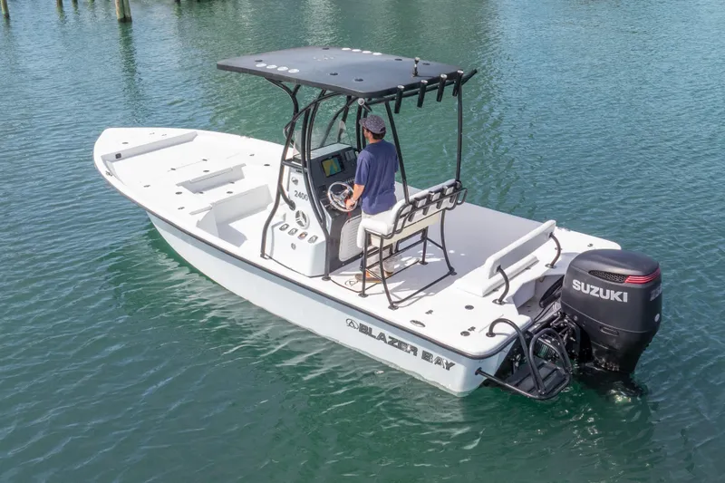 Slide: The Image of 2019 Blazer Bay 2400 boat with Suzuki engine on calm water. - 29