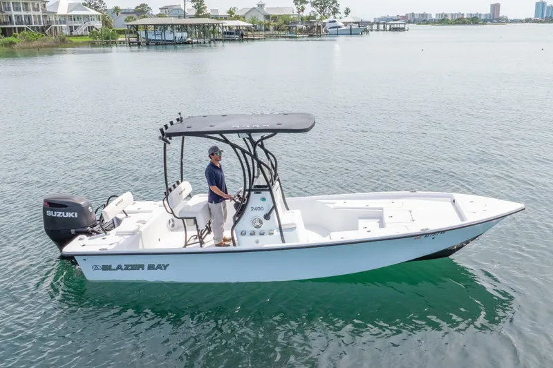 Slide: The Image of 2019 Blazer Bay 2400 boat with Suzuki engine on calm water. - 32