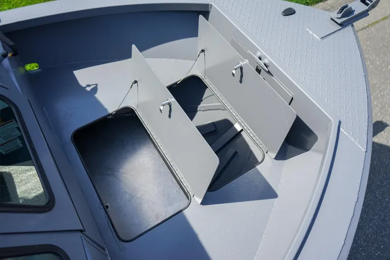 Slide: The Image of 2026 Alumaweld Talon 18 boat storage compartments, open and ready for use. - 16
