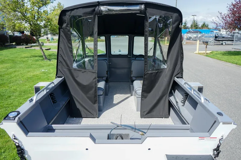 Slide: The Image of 2026 Alumaweld Talon 18 boat interior with canopy, showcasing seating and storage. - 4