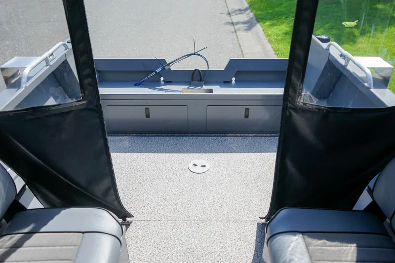 Slide: The Image of 2026 Alumaweld Talon 18 boat interior with seating and storage compartments. - 5