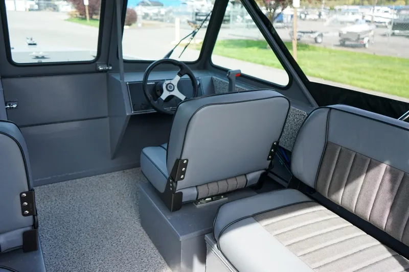 Slide: The Image of Interior of 2026 Alumaweld Talon 18 boat, featuring modern seating and steering wheel. - 9