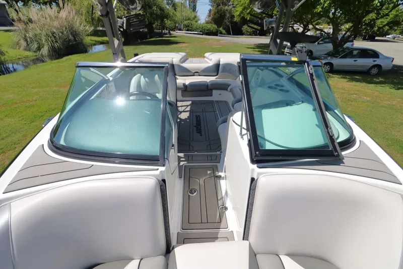 Slide: The Image of Interior of a 2018 Sanger 212 SL boat with spacious seating and cup holders. - 15